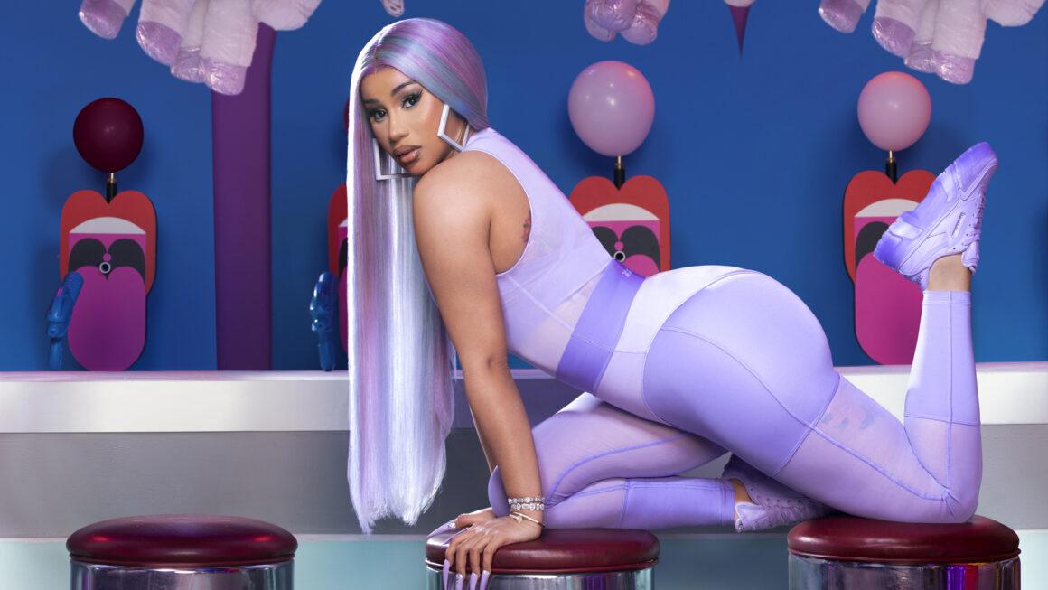 Reebok has announced its first-ever apparel collection with rap star Cardi B, dubbed "The Summertime Fine" Collection. Set to launch alongside matching footwear colorways of the Cardi B Club C, the drop is coming officially on April 23. A collaborative effort between Reebok and Cardi B, the fabrics and detailing of the apparel collection were thoughtfully curated from the beginning design stages through the entire creation cycle. Having tried on every piece herself, nothing went to production without Cardi’s seal of approval. The collection draws inspiration from the 90s, with nods to vintage Reebok apparel and Cardi’s distinct memories of summers spent on the Coney Island boardwalk with friends. The range also reflects her bold and transparent personality that influenced the transformation of traditional Reebok silhouettes into a collection sure to be unapologetically in your face. “I’m so proud to announce my first apparel line with Reebok,’ Cardi said on the debut collection. “This collection gives every woman the product they need to feel sexy and confident; the waist-snatching tights and curve hugging silhouettes make every body look amazing.” Designed with the female figure in mind, the bold color combinations of pastel purple and bright red are sure to turn heads, while waist-cinching details and contouring cutlines, infused with flirtatious mesh cutouts create that iconic 90s inspired layered look that is totally and completely Cardi B. The colors and materials used in the collection play on day and night monochromatic looks so the versatility of the items can take you straight from the gym to the streets. All apparel will be available in inclusive sizing from 2XS to 4X, bringing this collection to all Cardi fans. The Summertime Fine Collection will be available to purchase alongside matching footwear colorways of the Cardi B Club C , available in women’s and kid sizes, at 10am ET April 23 on Reebok.com.